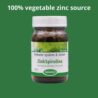 Bottle of ZinkSpirulina with a green background and text about a 100% vegetable zinc source.