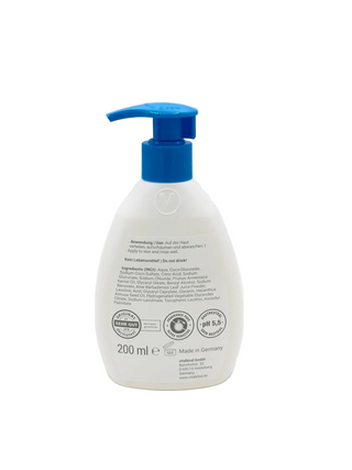 White bottle with blue pump on a white background
