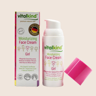 Vitalkind moisturizing face cream for girls with packaging on a beige background