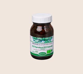 Vitamin supplement bottle with label on a beige background