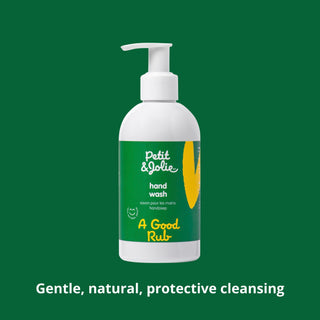 Petit & Jolie hand wash bottle on a green background with text about gentle, natural cleansing.