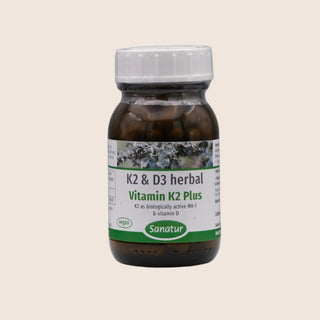 Bottle of Vitamin K2 & D3 herbal supplement with a white background