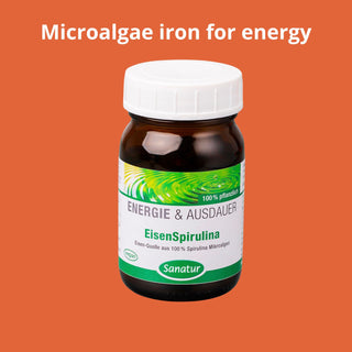 Bottle of EisenSpirulina with a white cap on an orange background, labeled 'Microalgae iron for energy'.
