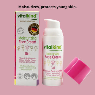 Vitalkind moisturizing face cream for girls on a pink background