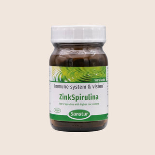 Bottle of ZinkSpirulina with a green label on a beige background