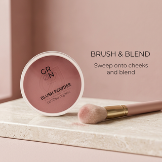 GRN Rosewood blush beside a brush with cheek application and blending instructions