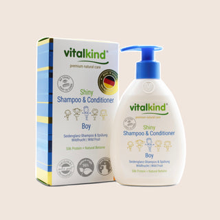 Vitalkind Shiny Shampoo & Conditioner for boys with packaging on a light beige background